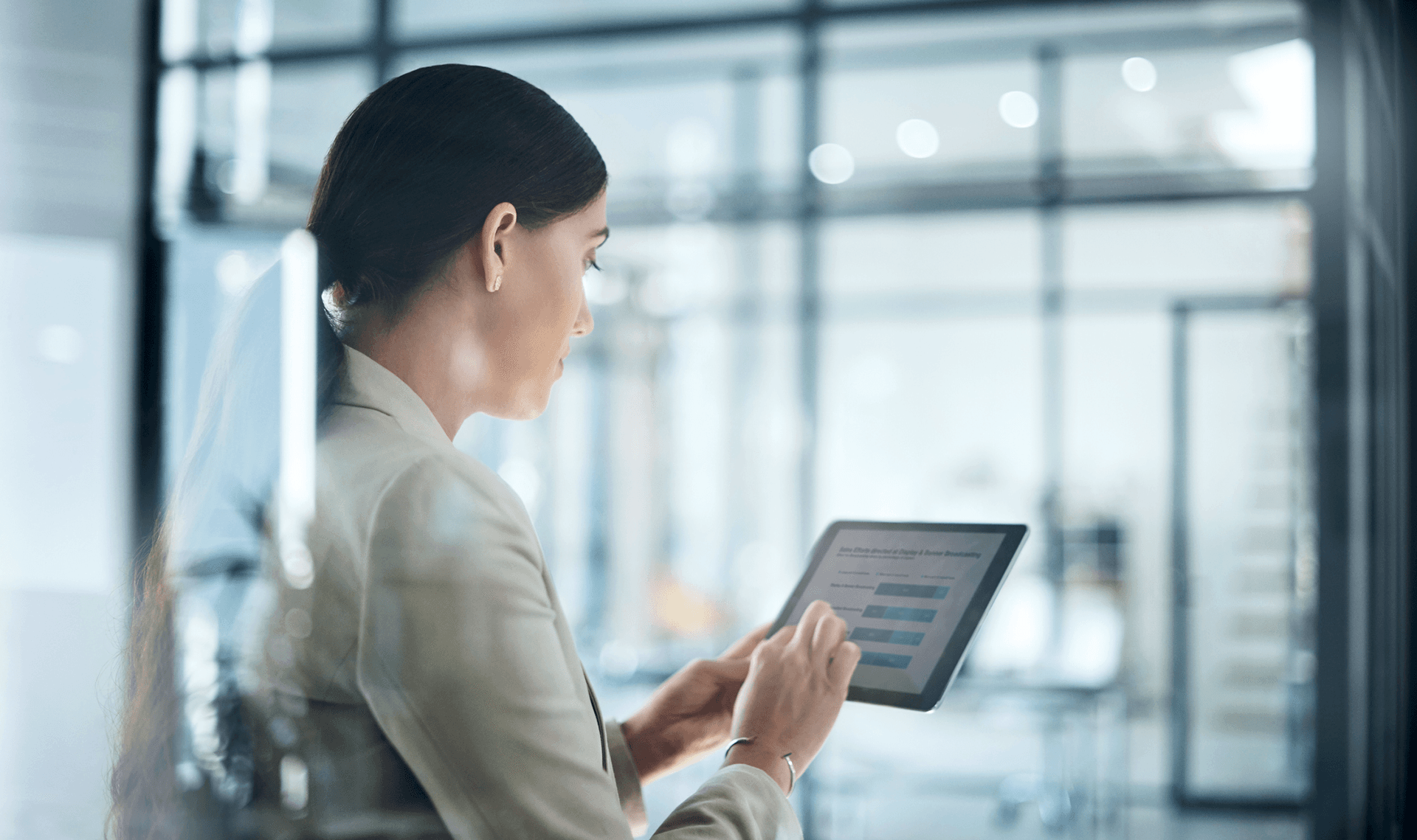 A woman works on a tablet